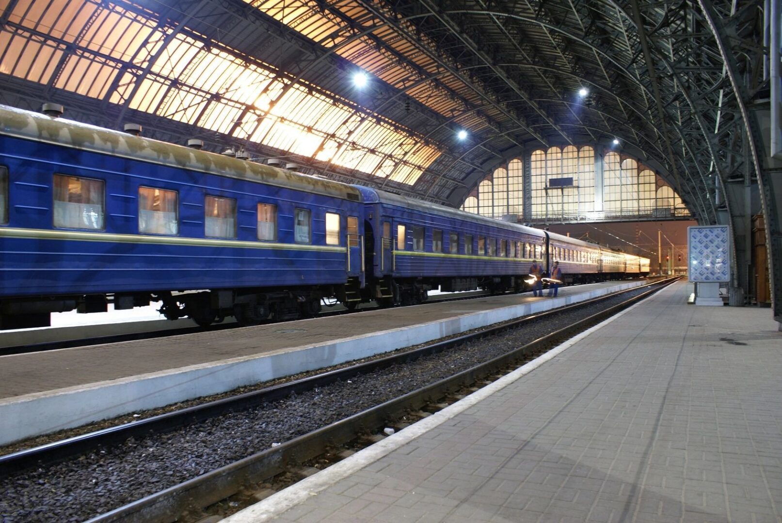 A train is parked at the station waiting for passengers.