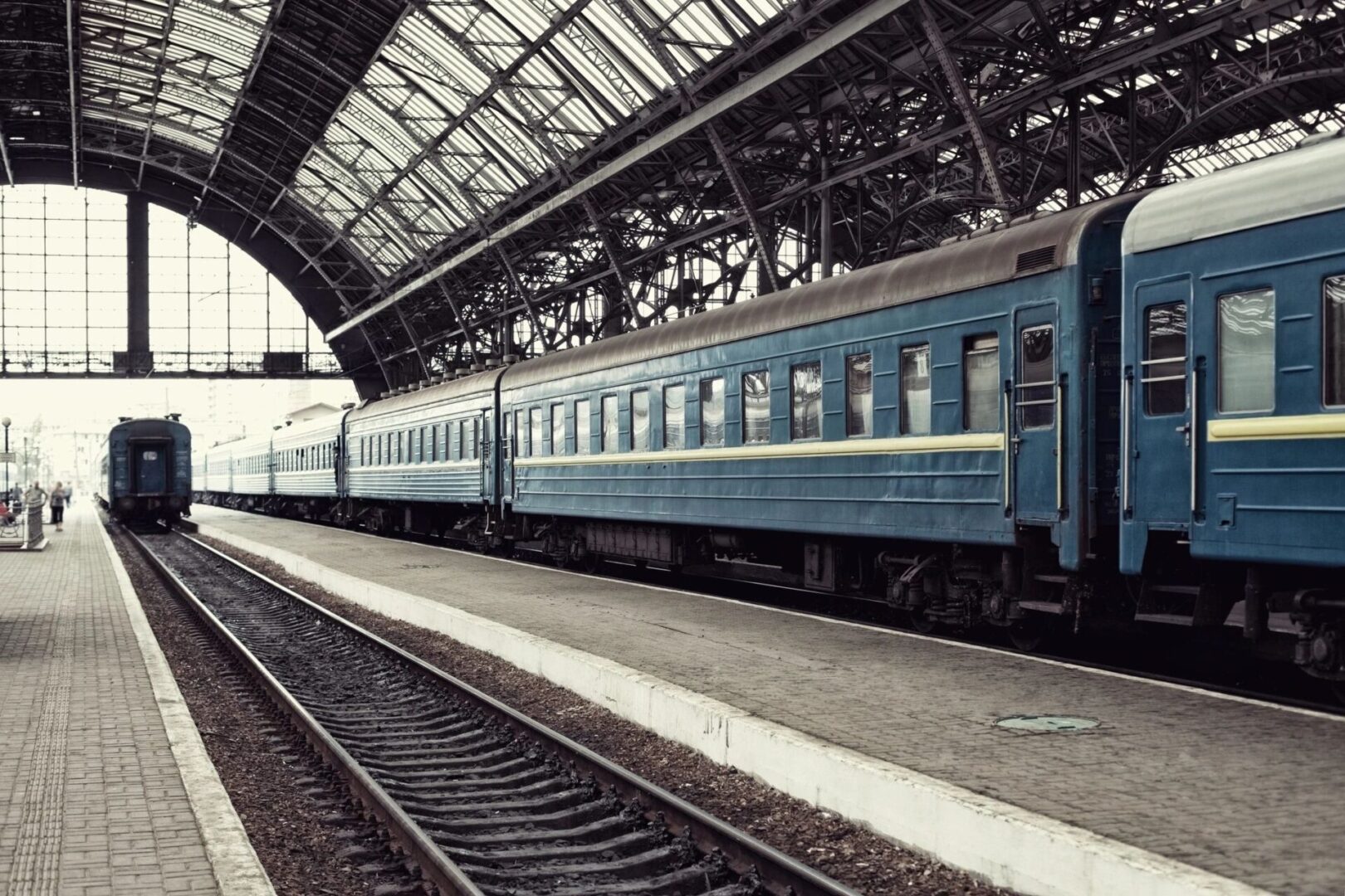 A train is parked at the station waiting for passengers.